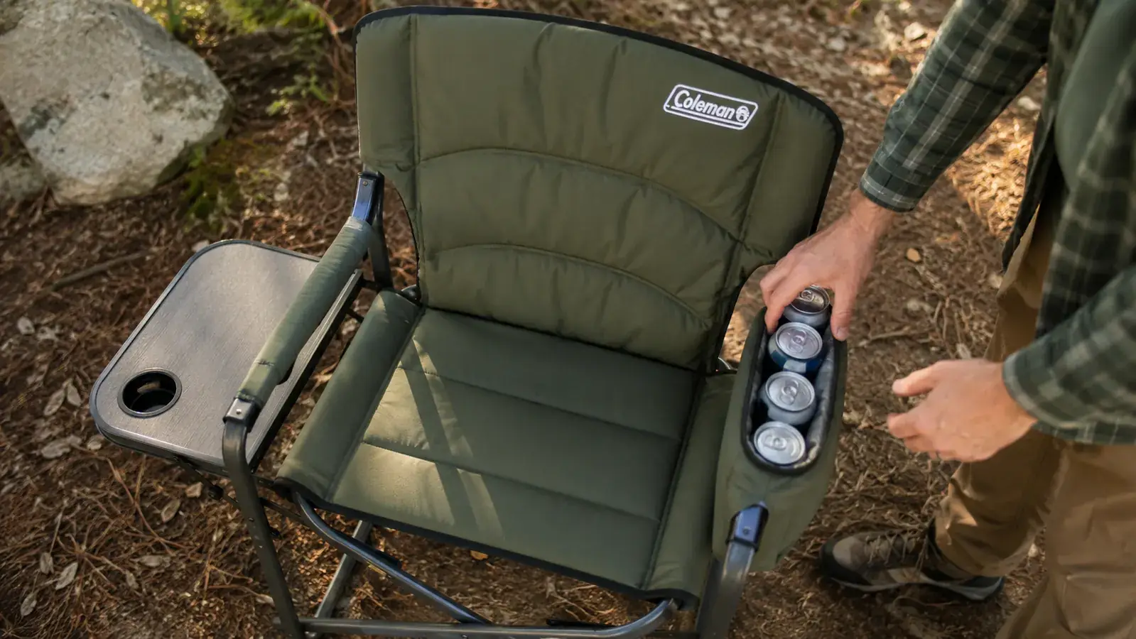 Coleman camping chair built-in cooler pocket filled with canned drinks, visible from above