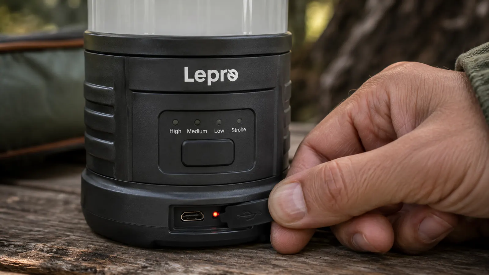 Close-up of the Lepro lantern charging port cover and LED indicator light on the base